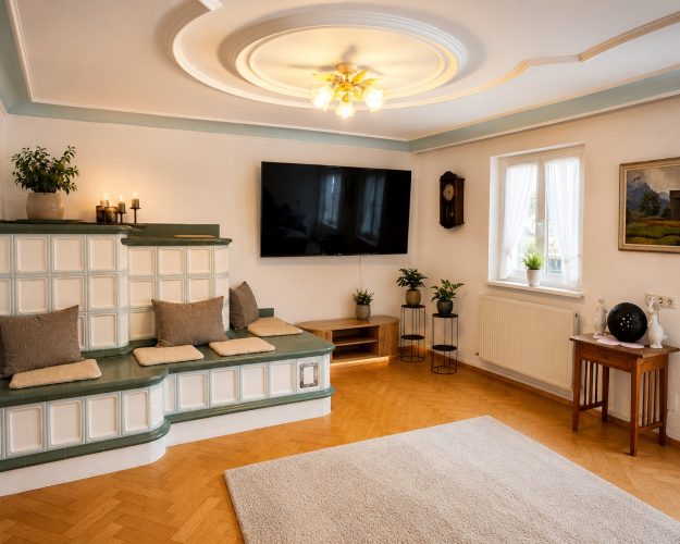 haus-bergharmonie-wohnzimmer-kachelofen-tv-premium